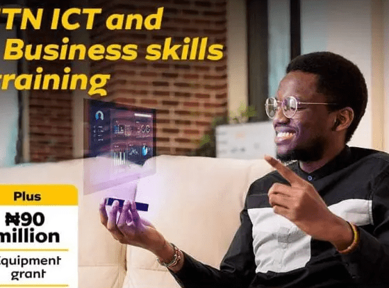 A visionary at the MTN Foundation ICT training utilizes a device projecting a holographic phone screen, illustrating the innovative digital skills imparted during the training.